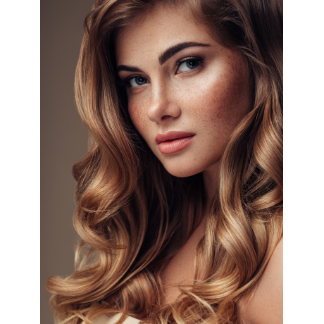 Young beautiful model with long wavy well groomed hair